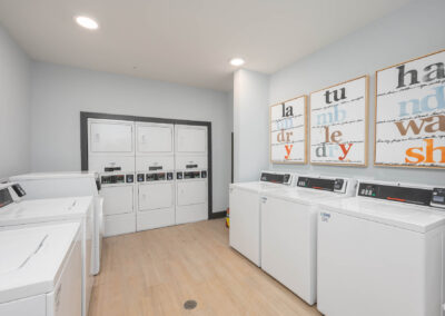 resident laundry center with washers and dryers at The View at NoDA apartments in Athens Georgia